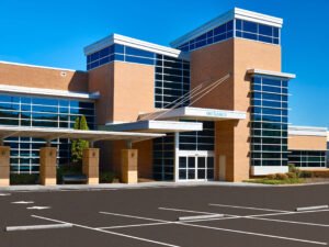 Exterior architectural photograph of the Knoxville Orthopaedic Clinic surgery center entrance canopy and brick facade at Fort Sanders West by Dwayne Hickson, Graphic Productions in Knoxville, TN.